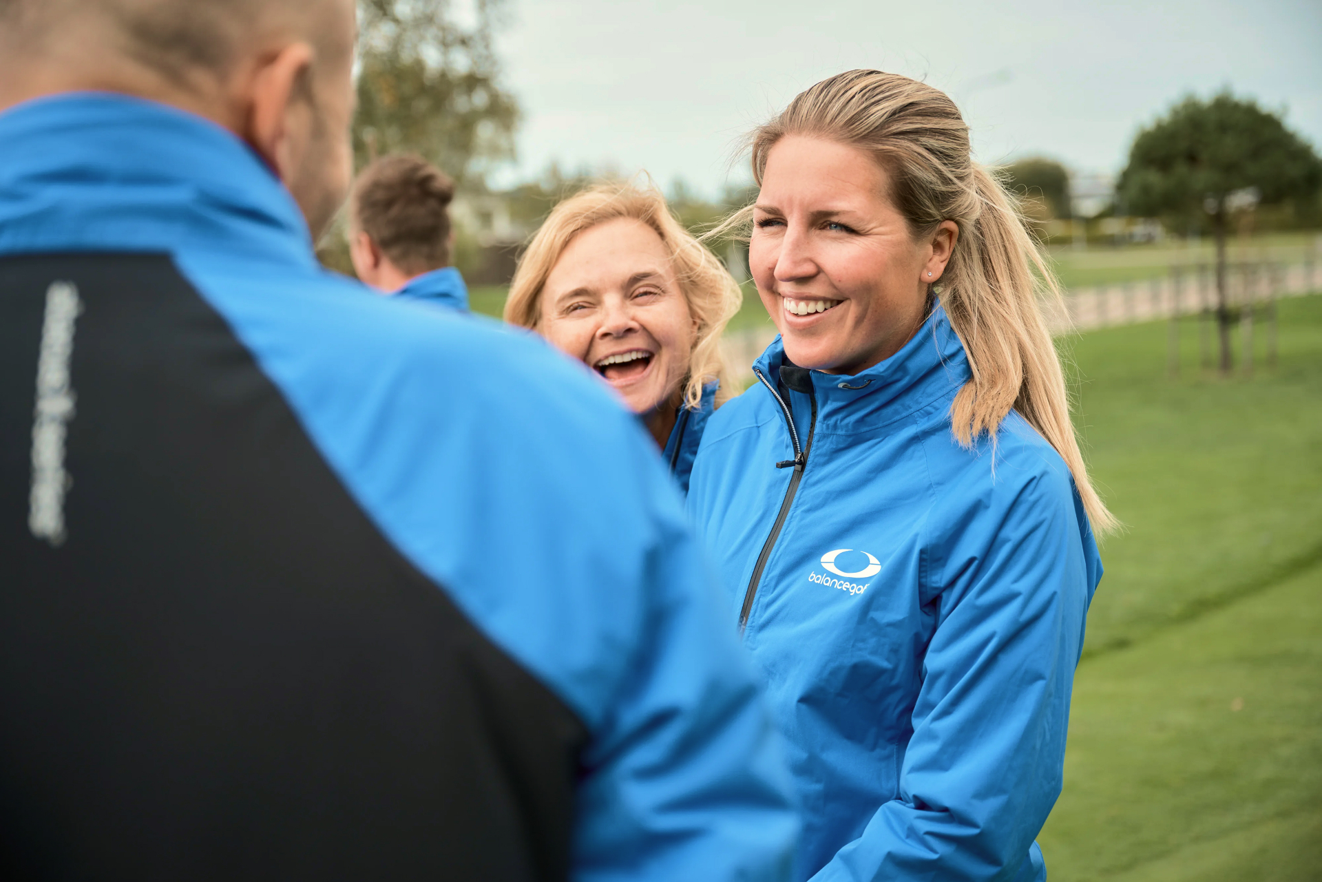 Balance Golf coaches laughing together